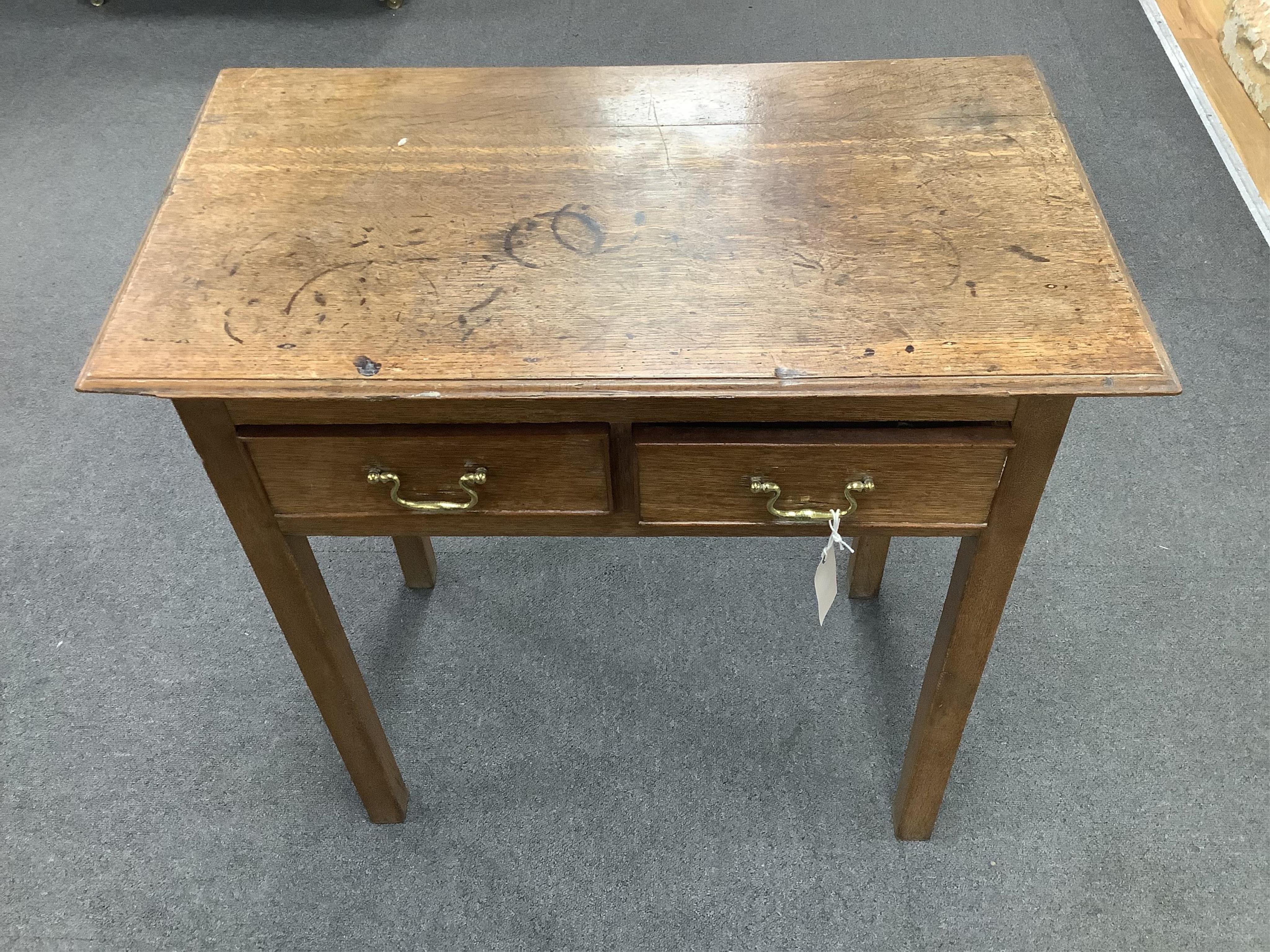 A small 18th century oak two drawer side table, width 69cm, depth 39cm, height 70cm. Condition - poor to fair